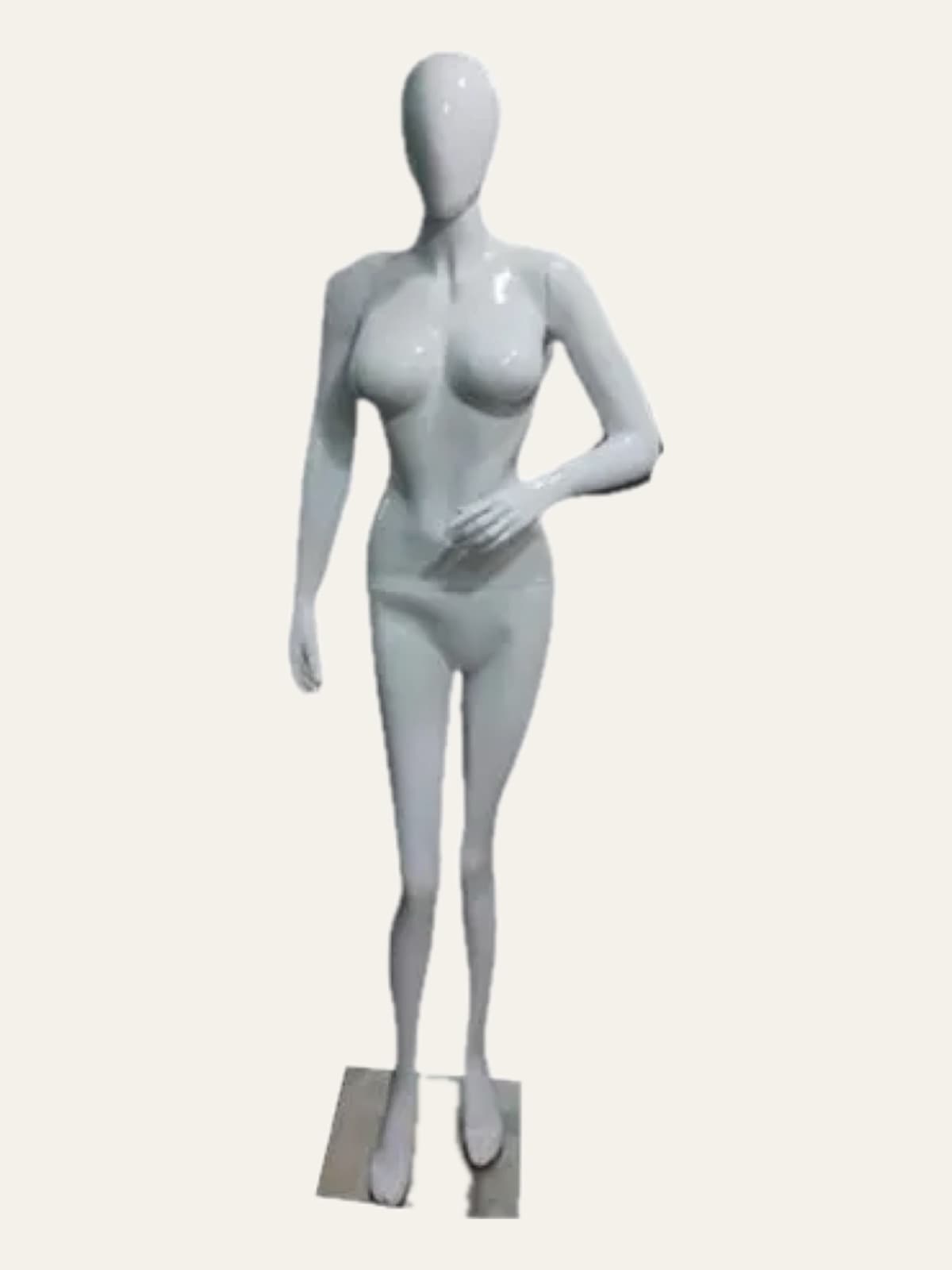 White female full-body mannequin standing on a small metal base
